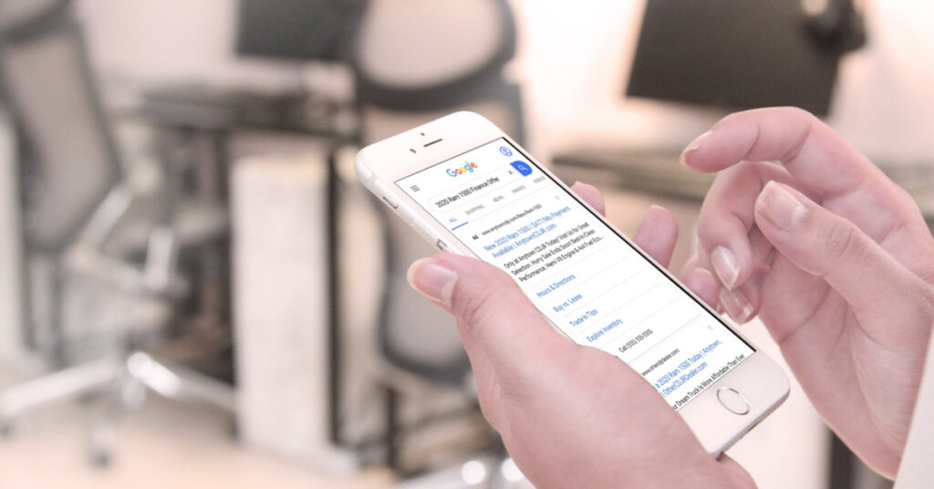 200729.1---FCA-Paid-Search-Ad-Mobile---LIFESTYLE---1200x628 CDJR dealer paid search ad on phone