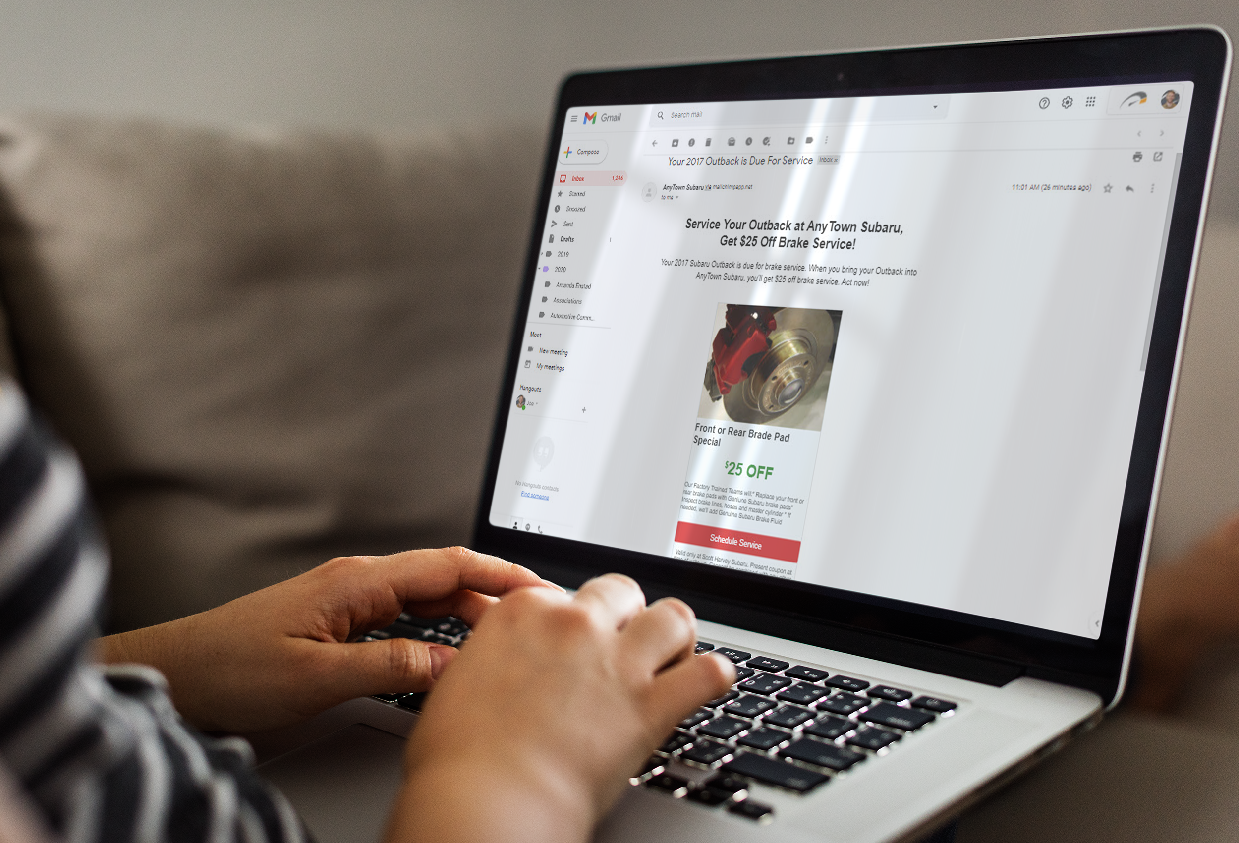 Image of a person on a laptop computer looking at a service offer via email